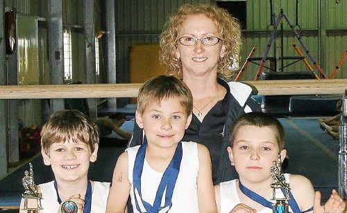 Warwick Gymnastics Club stars Jesse Archie, Ethan Oloman and Kaleb Tapping with coach Lisa Frattini at rear. Warwick Gymnastics Club stars Jesse Archie, Ethan Oloman and Kaleb Tapping with coach Lisa Frattini at rear.